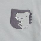 A light grey dinos design on a light grey shirt.