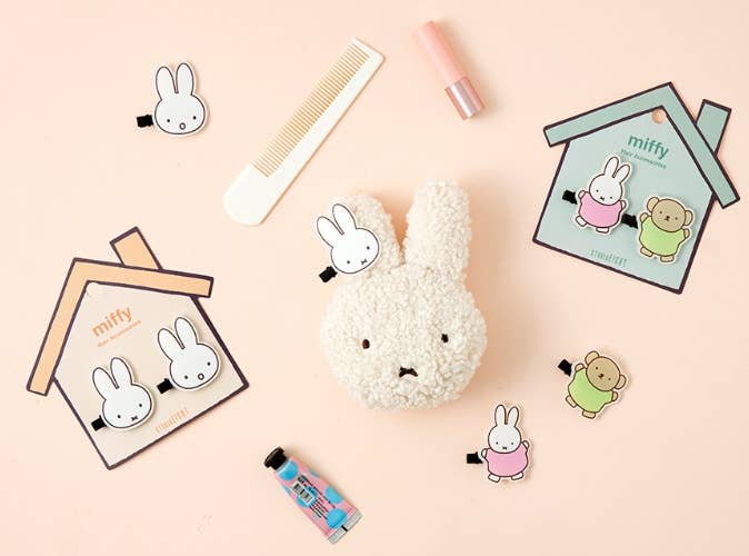 Miffy-themed stationery items on a beige background