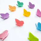 Colorful butterfly-shaped clips on a white background