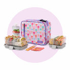 Colorful lunch bag with compartments and snacks on a white background