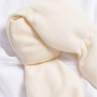 Close-up of beige fabric on a white background