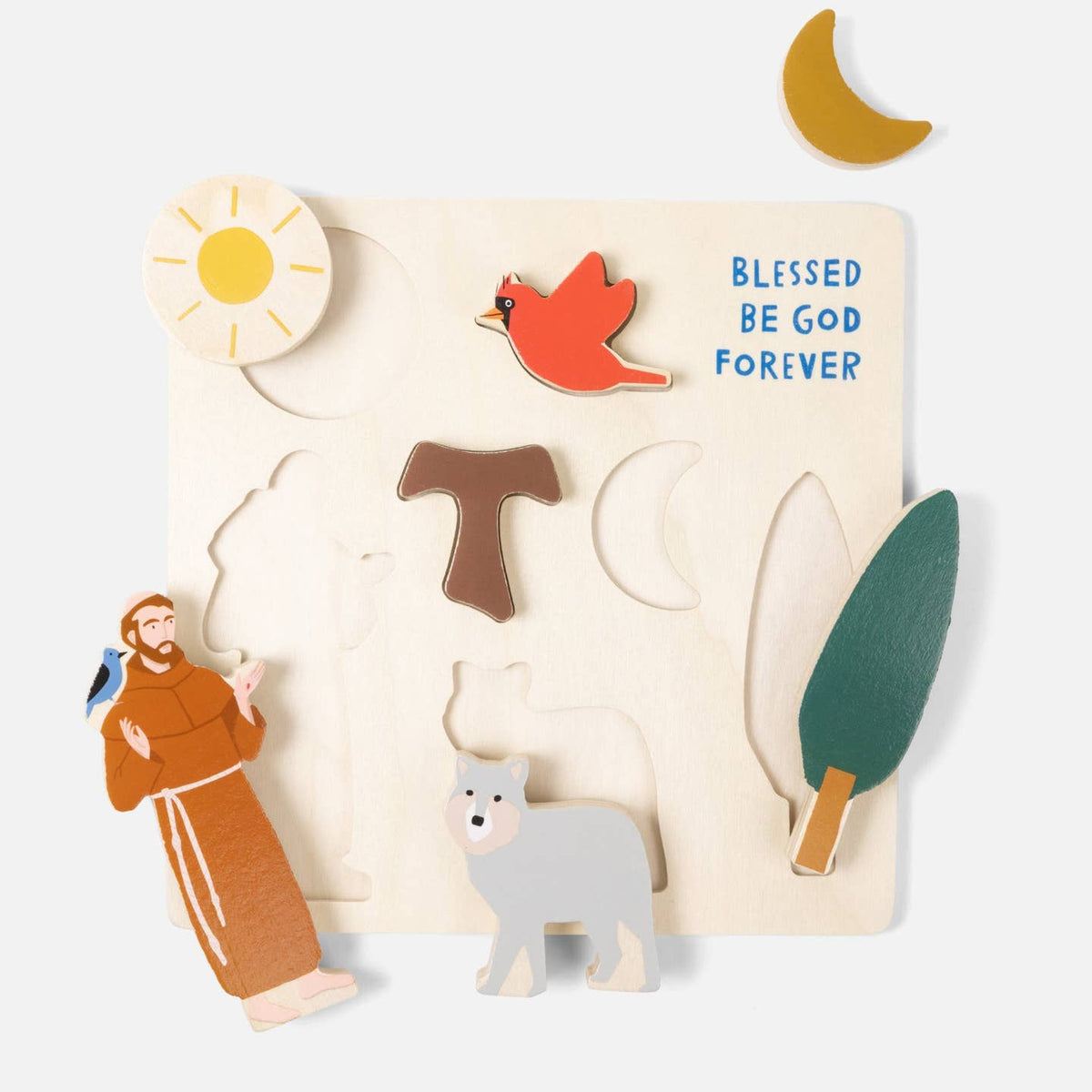 Wooden puzzle with religious figures, animals, and nature elements on a white background.