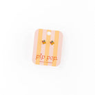 Pair of earrings on a 'pip pop.' branded card against a white background