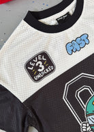 Close-up of a sports jersey with 'Level 3 Unlocked' and 'FAST' text, on a gray background.