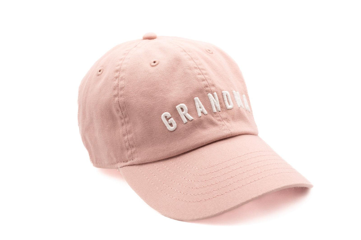 Pink cap with 'GRANDMA' text on a white background