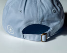 Light blue cap with a logo on the back against a light background