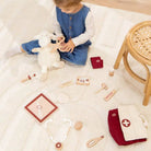 Child playing with toys on a light-colored floor