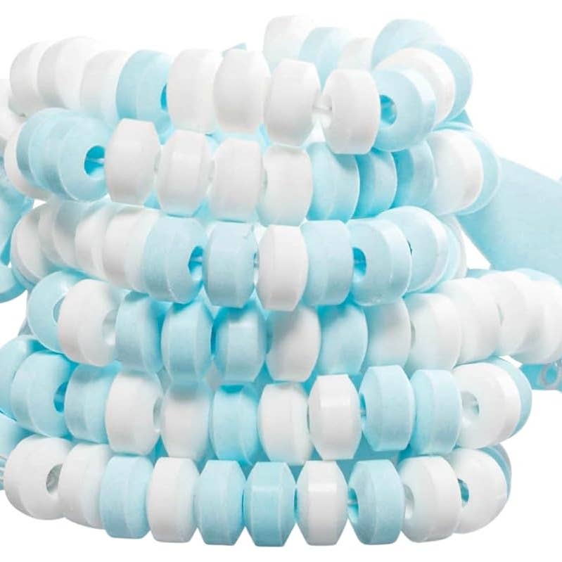 A stack of round plastic beads in alternating light blue and white colors, photographed on a plain white background.