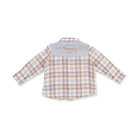 A children's long-sleeve plaid shirt shown from the back, featuring a white base with tan and light blue checkered pattern, a light blue collar, and 'Howdy U' embroidered in tan on the collar.