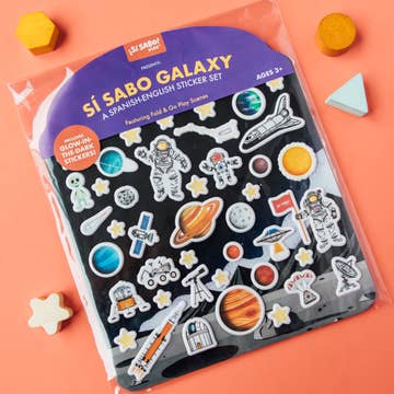 Sí Sabo Galaxy sticker set packaging on a pink background with space-themed stickers.