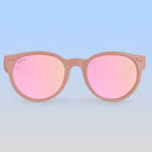 Sunglasses with pink gradient lenses and brown frames on a white background