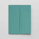 A minimalist teal notebook or journal with a matching envelope, shown flat-laid on a light gray background.