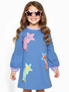 Featuring colorful embroidered star and shooting star motifs on the front, with purple striped trim on the collar and cuffs.