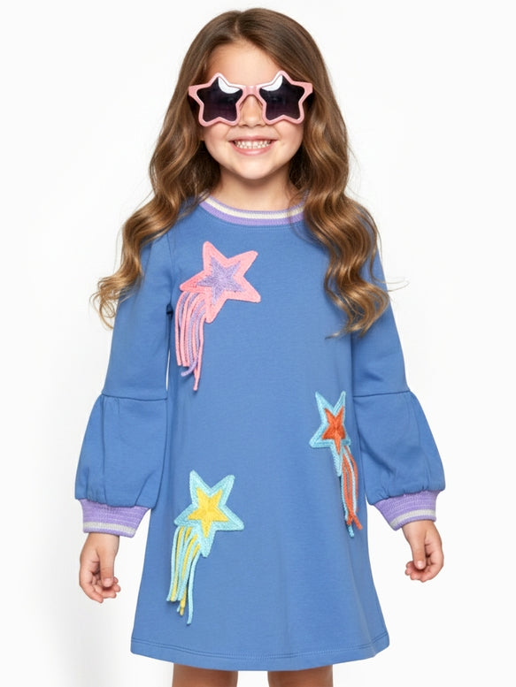 Featuring colorful embroidered star and shooting star motifs on the front, with purple striped trim on the collar and cuffs.