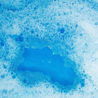 Close-up of blue bubbles on a white background