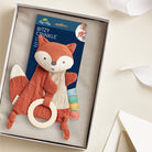 Fox-shaped baby rattle with crinkle sound inside a box, featuring its packaging.