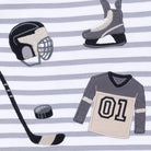 Hockey equipment including a helmet, jersey, stick, and puck on a striped background
