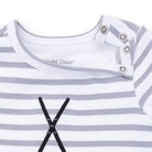Close-up of a baby outfit with striped pattern and 'Angel Dear' branding.