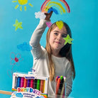 Child with colorful window gel crayons and craft items against a blue background