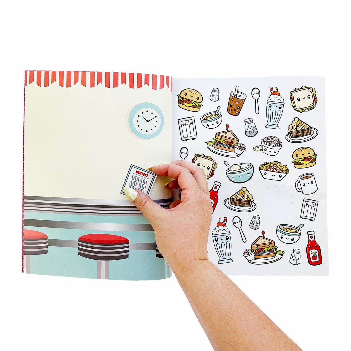 Sticker book with food and cafe illustrations being opened by a hand.