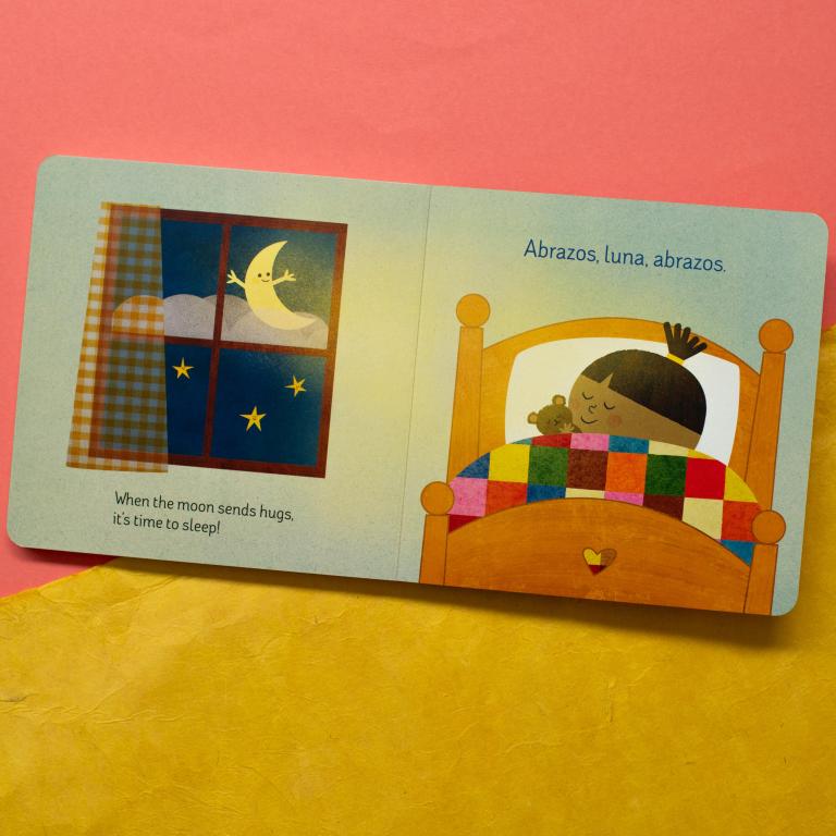 Children's book open to a page with a sleeping child and moon illustration on a pink and yellow background.