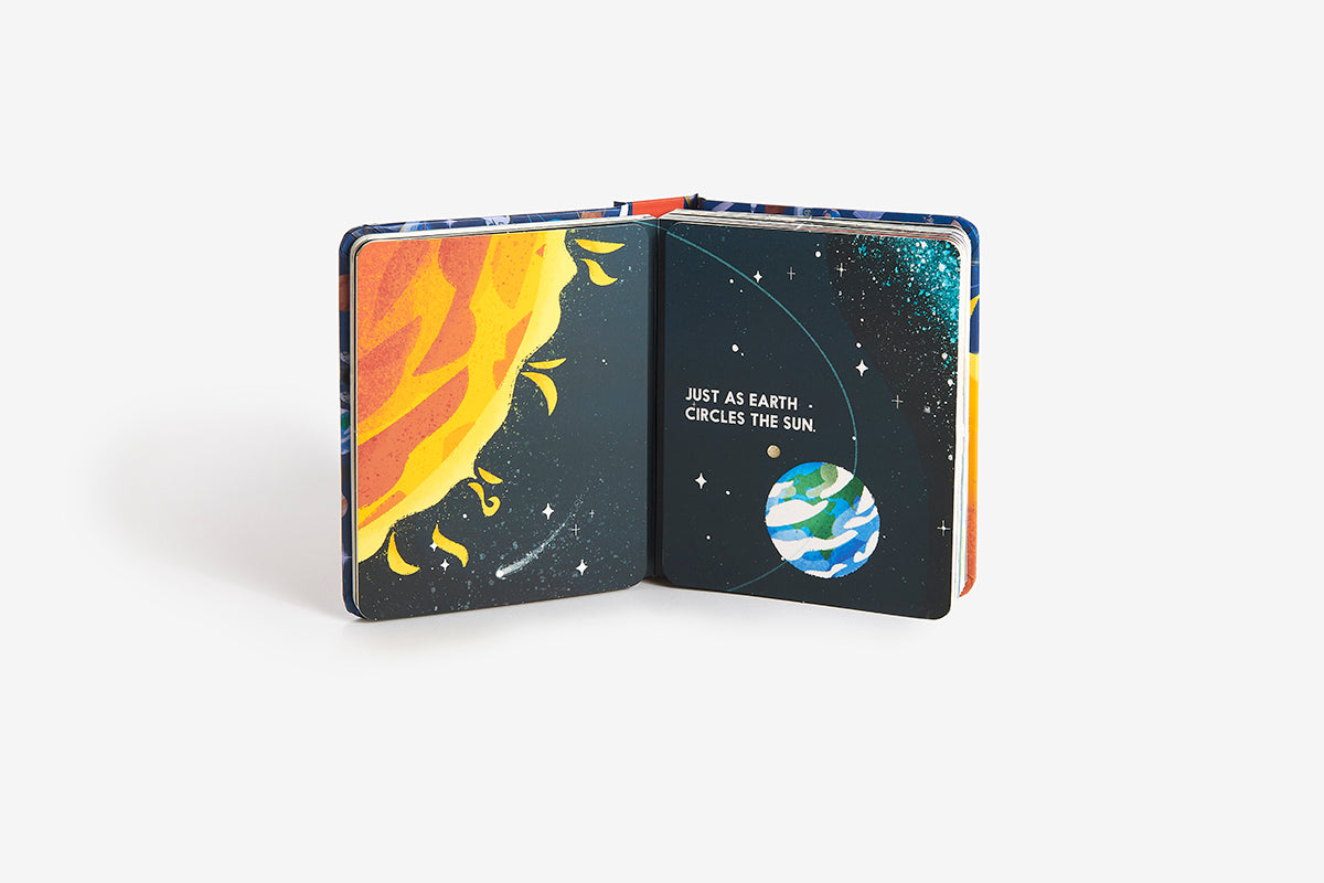 Open book with space-themed illustrations on a white background