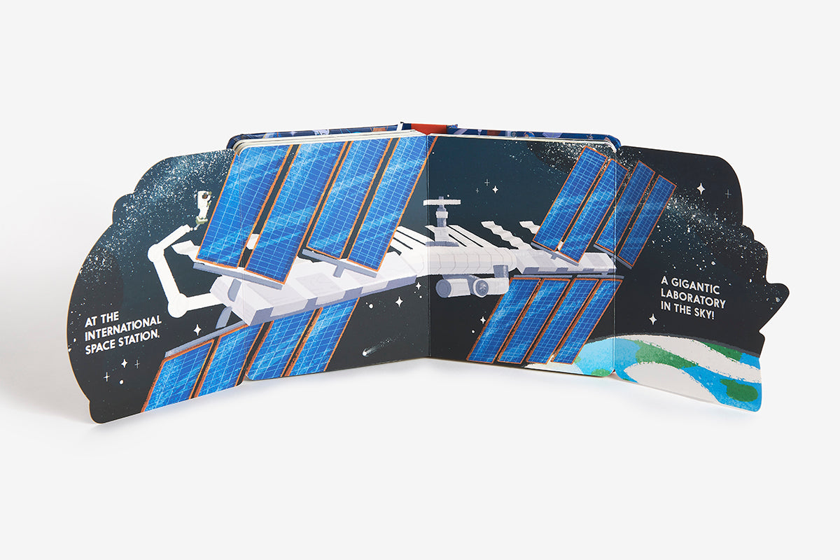 Model of the International Space Station with solar panels on a white background