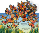 Illustration of orange and black butterflies with a scenic background
