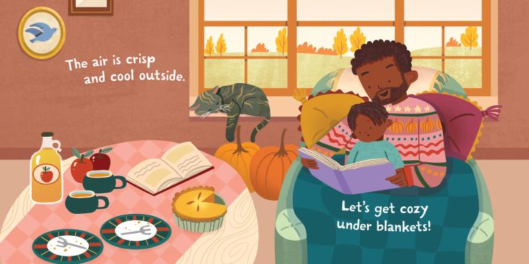 A warm illustrated family scene shows a father and child reading under blankets in a cozy room, with a table holding a bottle, apples, cups, plates, and a pie, plus a cat by the window. Text overlays read, 'The air is crisp and cool outside.