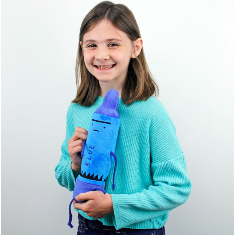 Young girl holding a blue plush toy with a purple top against a white background