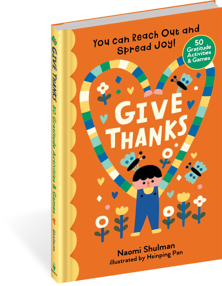 The book 'Give Thanks: 50 Gratitude Activities & Games' by Naomi Shulman, illustrated by Hsinping Pan, shown standing upright on a white background. The cover is bright orange with a large heart-shaped gratitude trail illustration in the center, featuring a child, flowers, and butterflies.