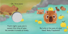 An illustrated spread from "Baby Capybara - Finger Puppet Book" showing a plush baby capybara finger puppet and several capybaras relaxing in a hot spring with yuzu fruit, alongside a finger hole and text that reads "Oh, it's a yuzu!", "That's right—yuzu are in season this time of year. No wonder it smells so lovely.", and "But why is the yuzu on your head, Baby Capybara?".