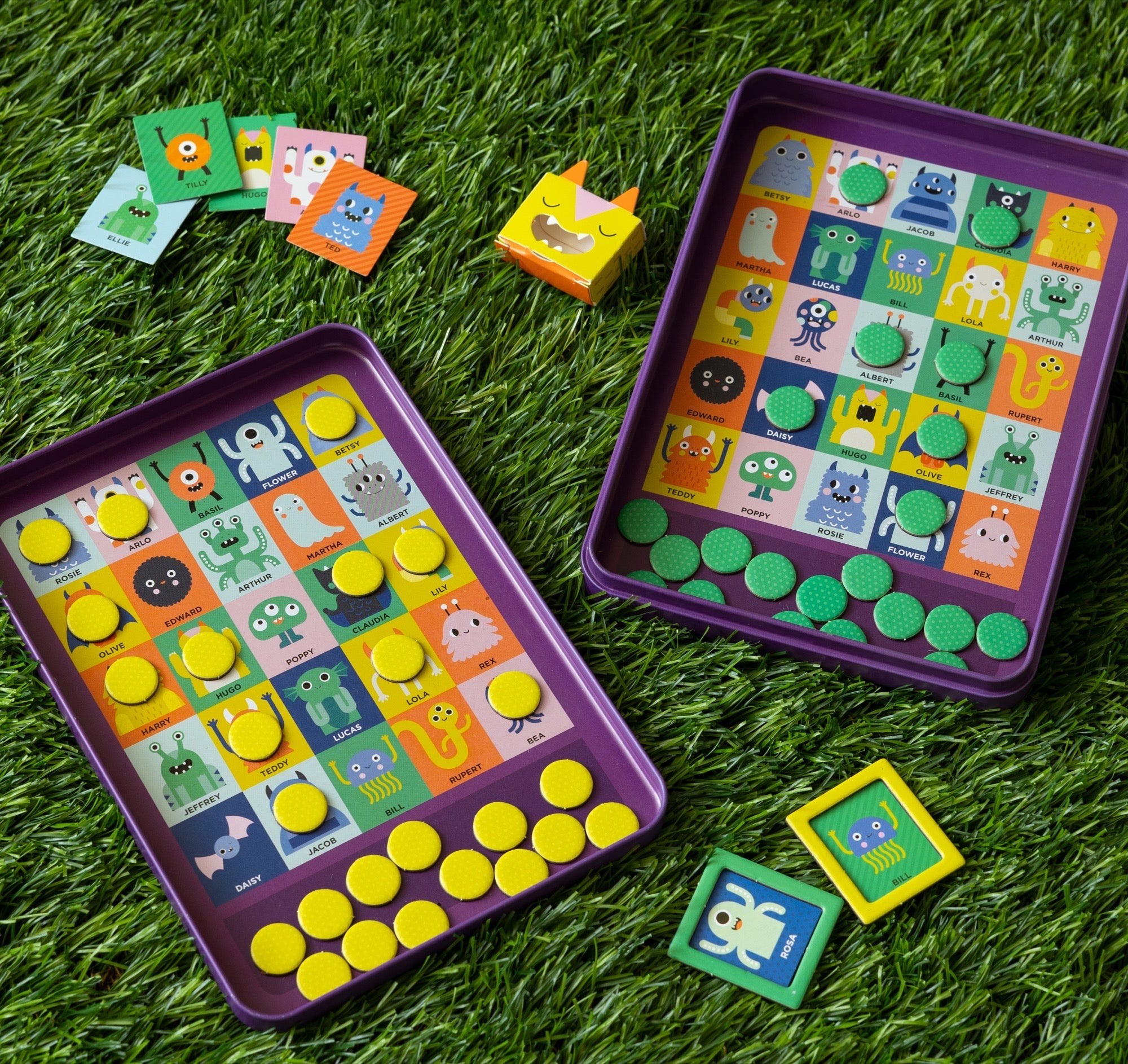 Colorful educational game with character buttons on a grassy background