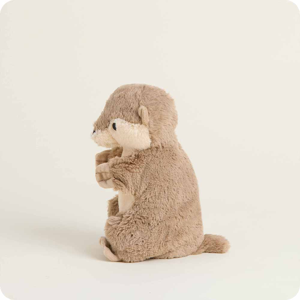 Plush toy otter sitting on a white background