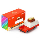 Wooden toy truck with a colorful box on a white background