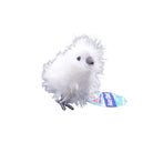 White fluffy toy with a blue and yellow tag on a white background