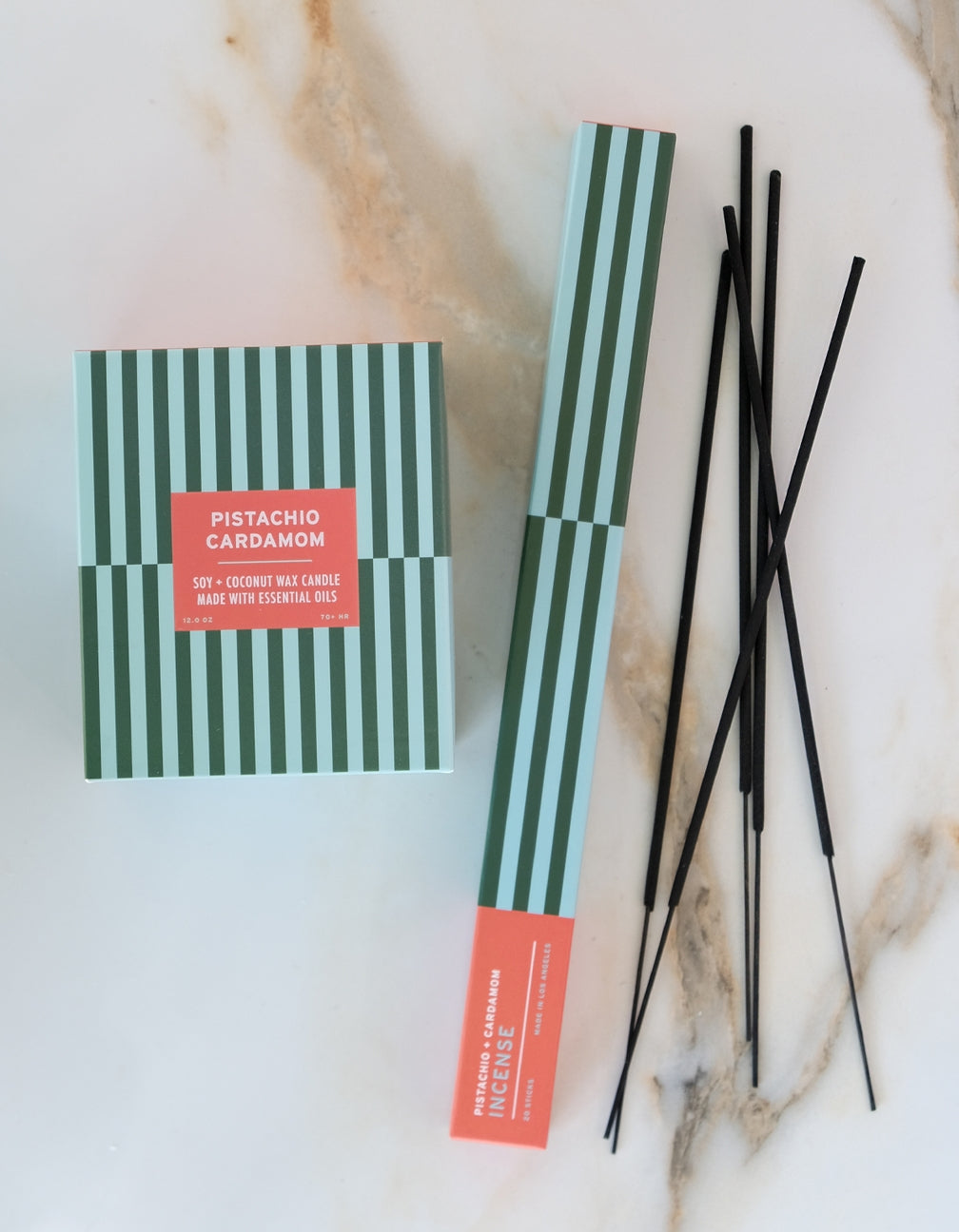 Pistachio Cardamom incense sticks with packaging on a marble surface