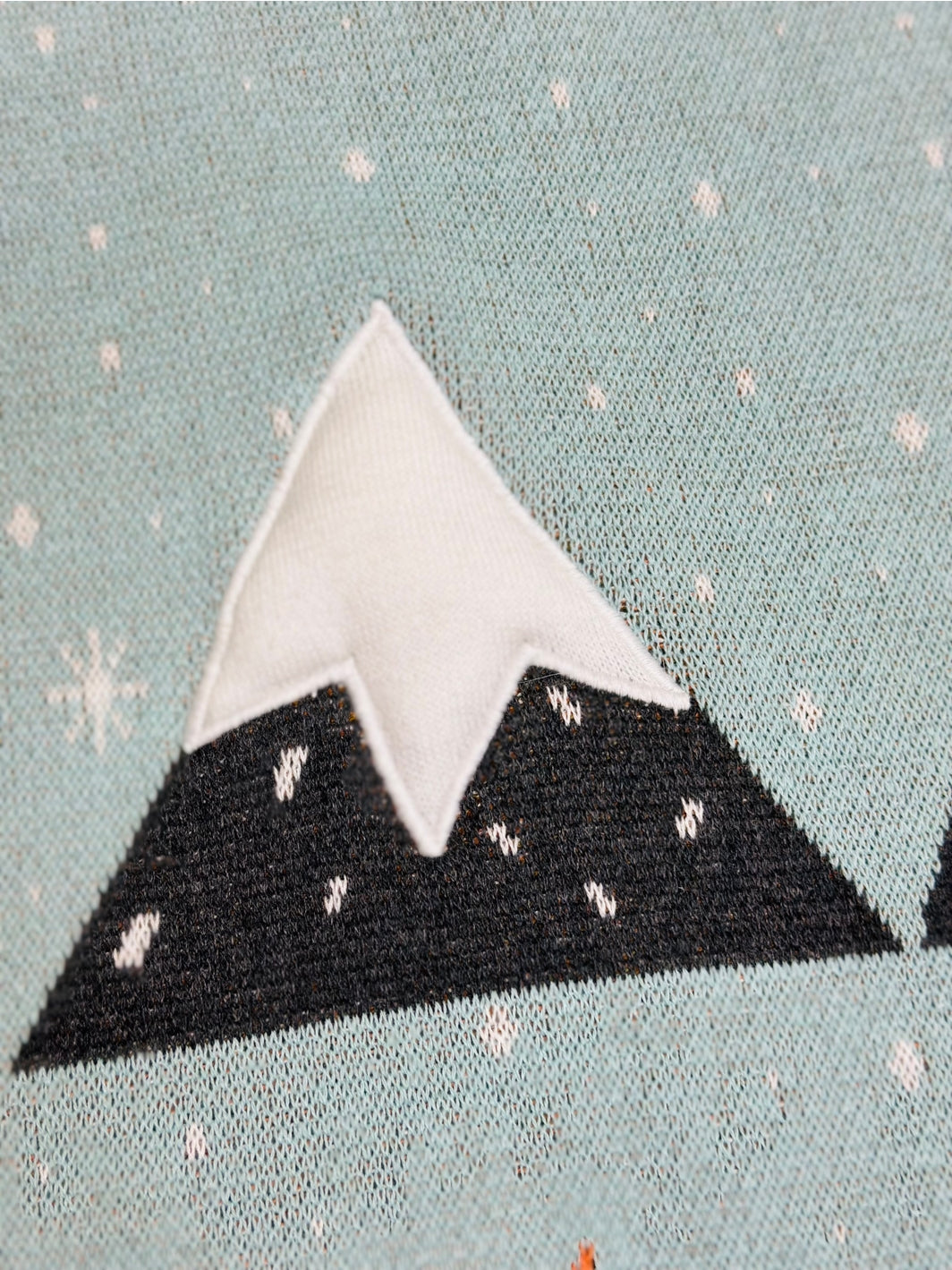 Mountain design on fabric with a light blue background