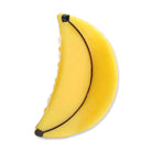 A crescent-shaped yellow product shaped like a banana, shown on a plain white background.