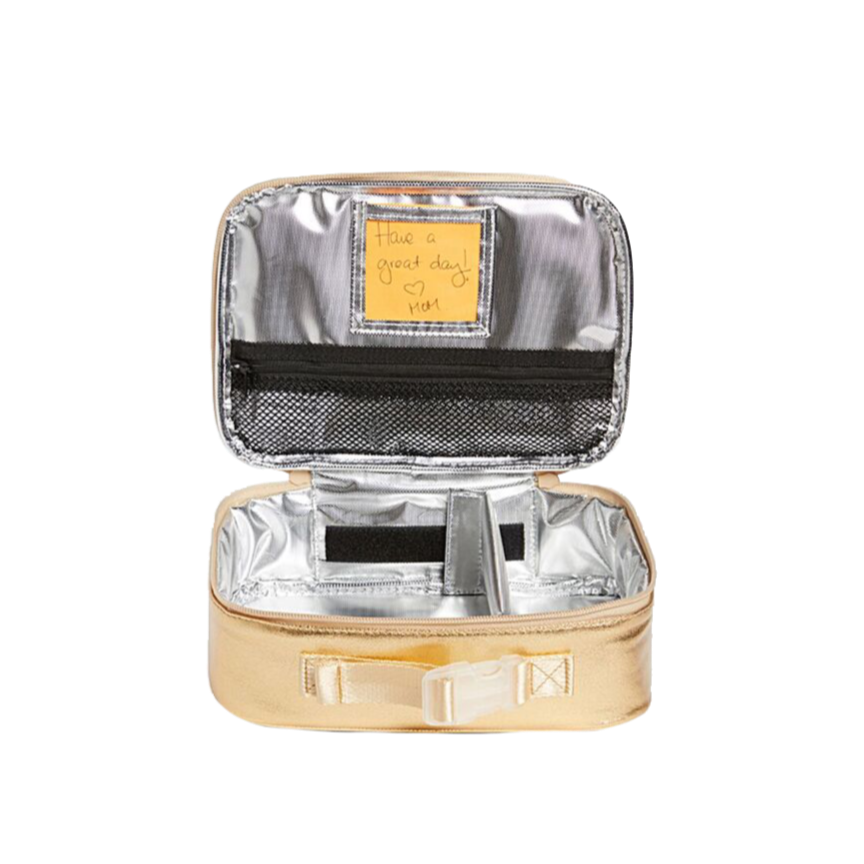 Small gold suitcase with silver interior on a white background