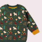 Children's sweater with forest animal pattern on a light gray background