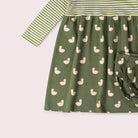 A two-piece baby girl's outfit set featuring a long-sleeve dress and matching bloomers. The dress has a top section with green and white horizontal stripes and a bottom section in olive green with a repeating duck print.