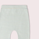 Close-up of a baby garment with horizontal mint green and white stripes.