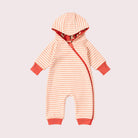 A baby long-sleeve footless romper with horizontal peach and white stripes, featuring solid peach cuffs and a peach side zipper, shown on a light pink background.