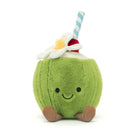 A plush toy in the shape of a green coconut with a smiling face, a red and white striped straw, and a white flower on top.