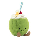 A plush toy in the shape of a green coconut with a smiling face, a red and white striped straw, and a white flower on top.