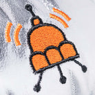 Embroidered design of a bee on a white fabric background
