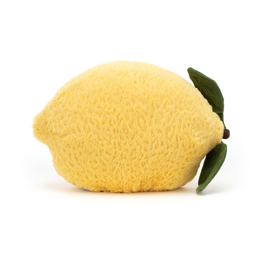 Plush lemon toy with green leaf on a white background
