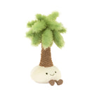 A plush palm tree toy with a smiling face, green fronds, and a white base.