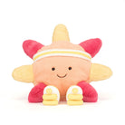 Plush toy starfish with a smiley face on a white background